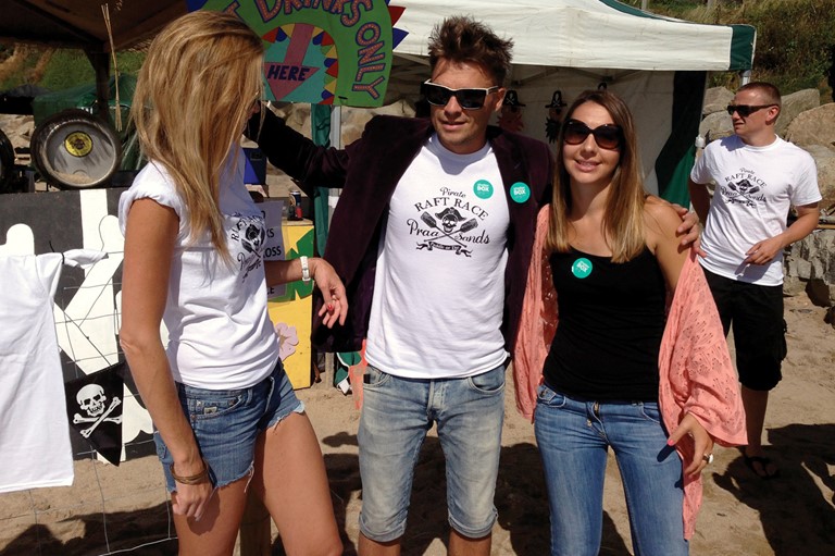 Simon selling his T-shirts to support Shelter Box, Praa Sands Pirate Raft Race
